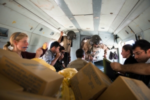 Pilots, journalists, and aid workers board a helicopter bound for Mount Sinjar on Aug. 12, 2014. (ADAM MIRANI)